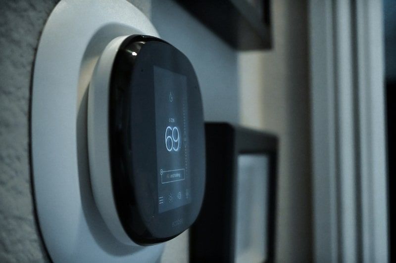 Smart thermostat on a wall
