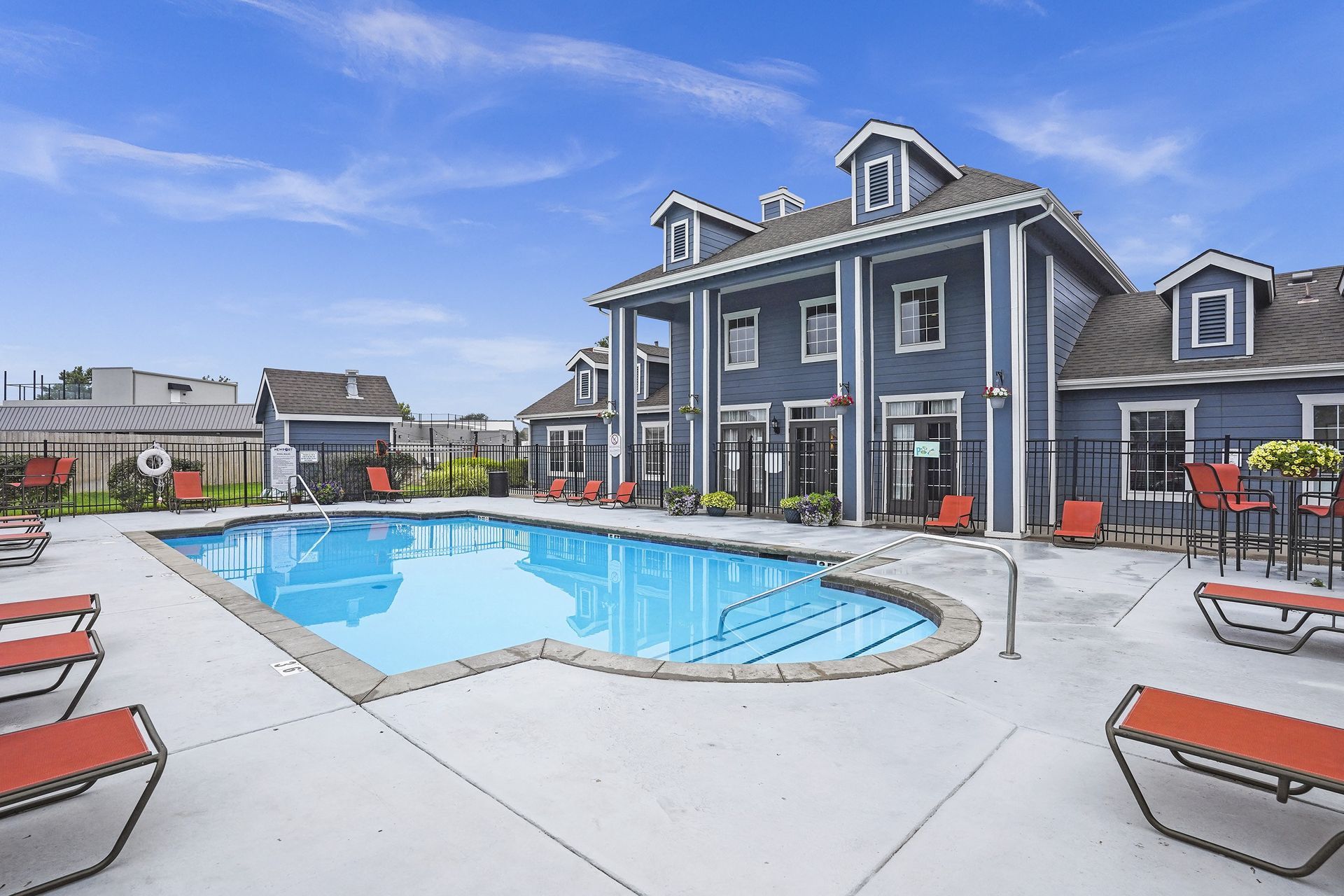 A large house with a pool in the backyard.