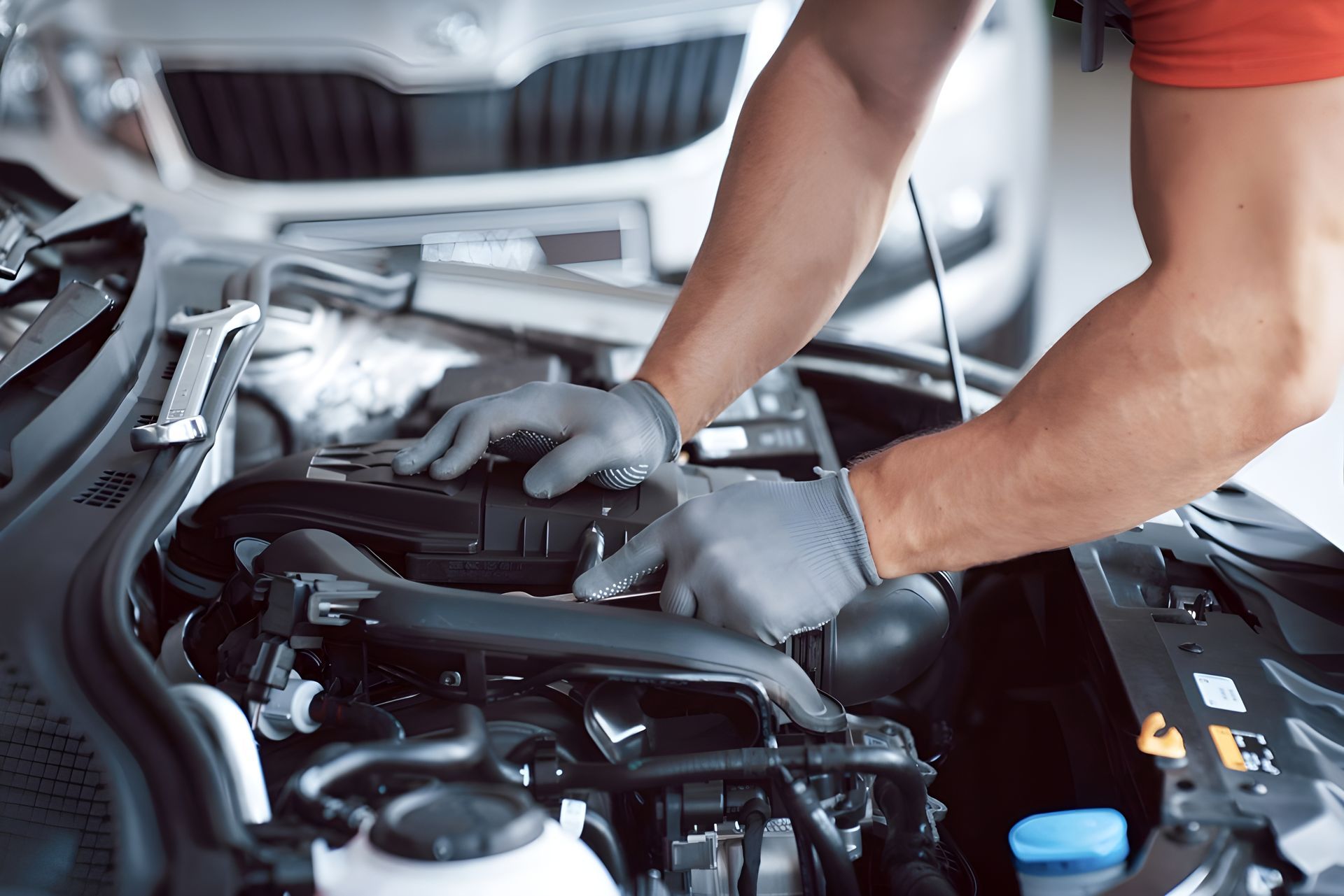 A man is working on the engine of a car — Steve Purse Automotive In Huskisson, NSW