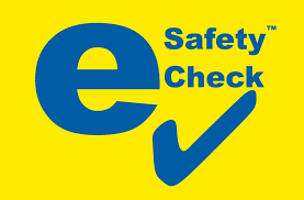 A Blue Safety Check Logo on A Yellow Background — Steve Purse Automotive In Huskisson, NSW