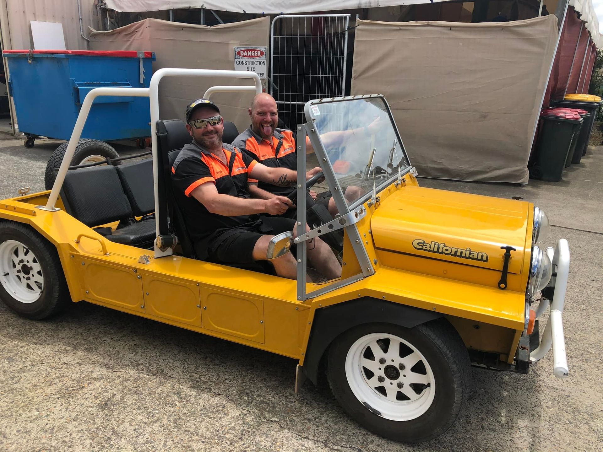 Two Men Are Sitting in A Yellow Jeep — Steve Purse Automotive In Vincentia, NSW

