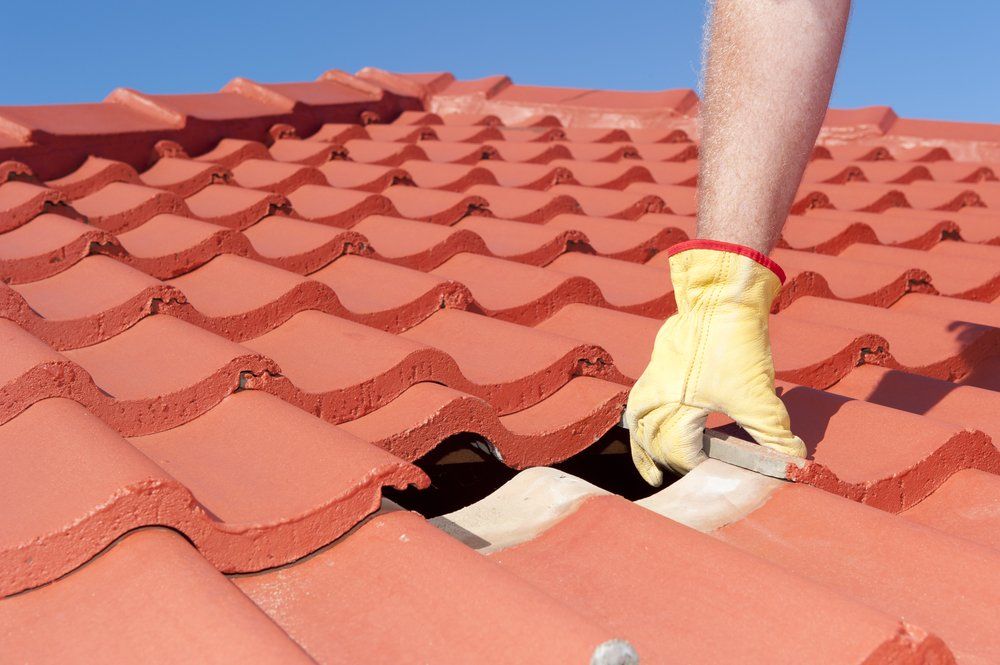 Replacing Roof Red Tiles — Gutter & Roof Repairs in Wollongong, NSW