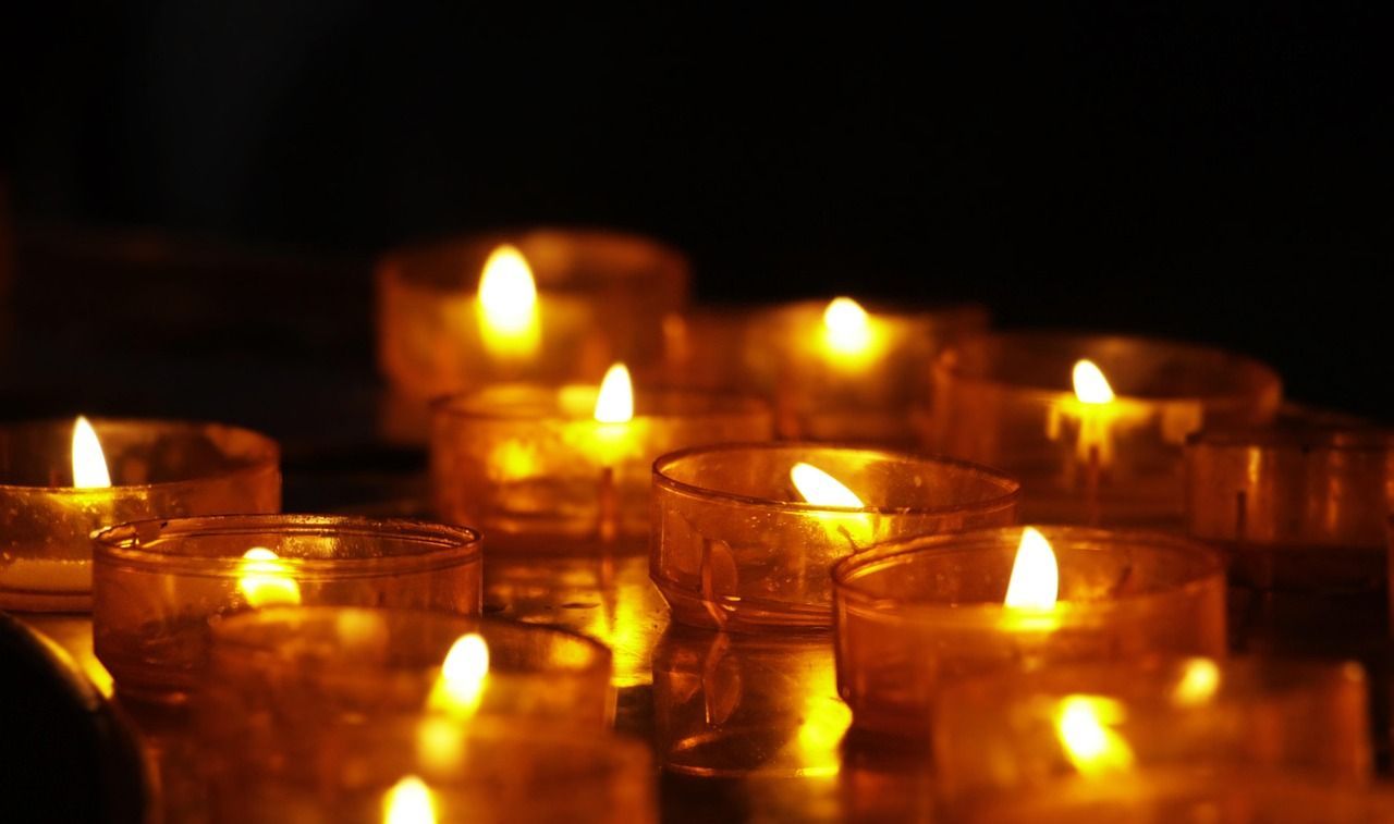 Close-up photo of a few lit-up candles