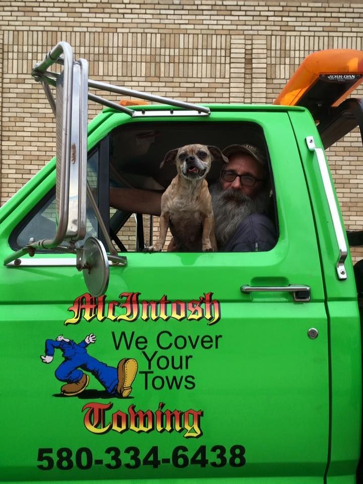 tow truck driver with his dog