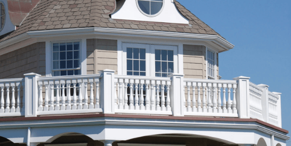 A house with a balcony on the top of it