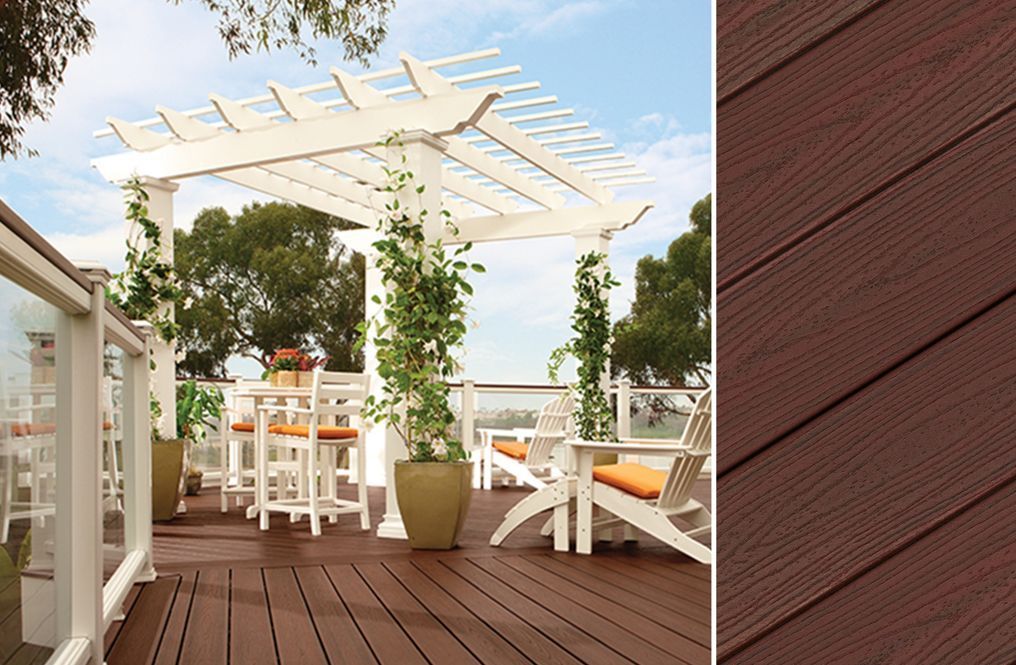 A deck with a pergola and chairs on it