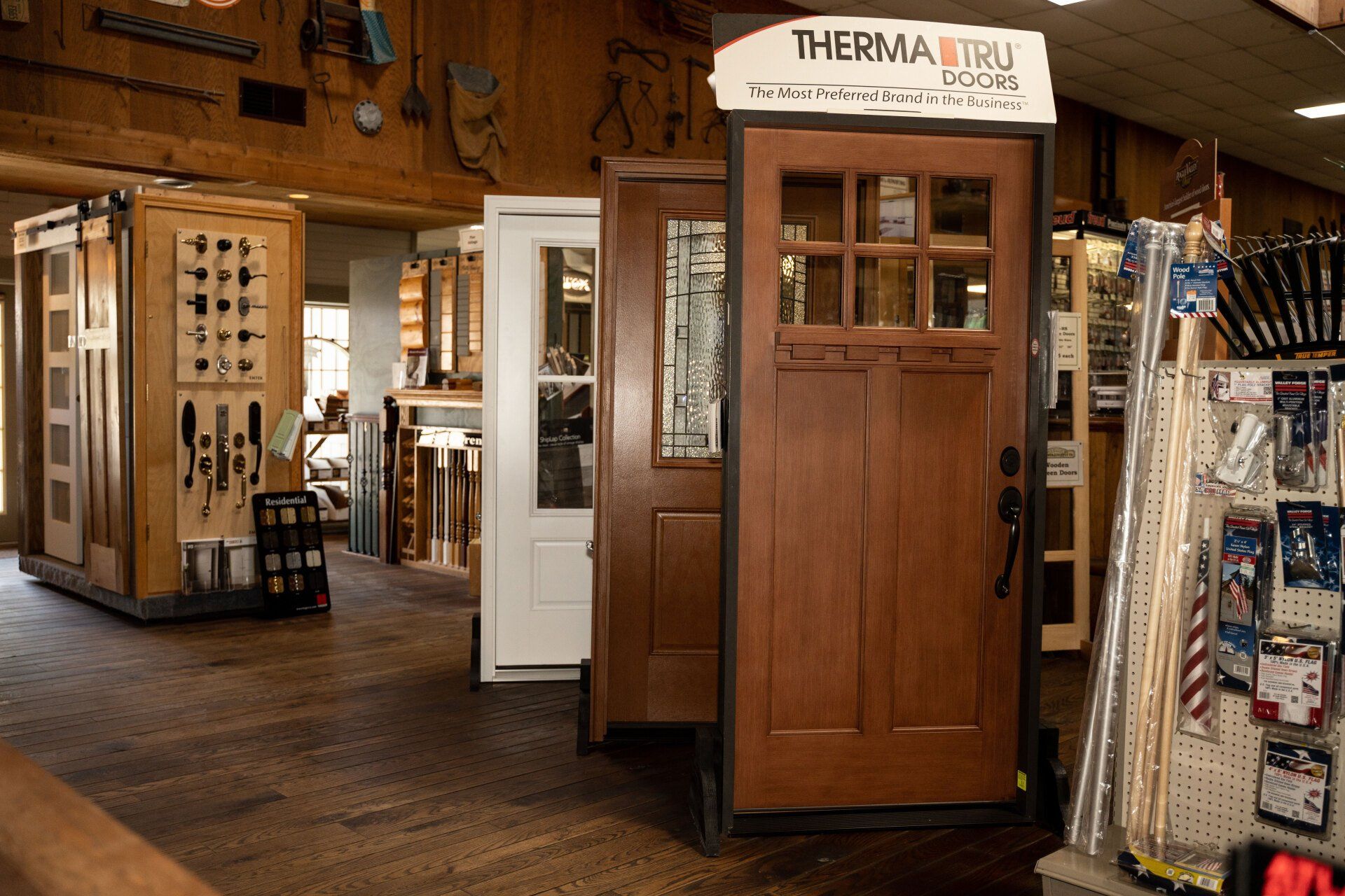 A wooden door is displayed in a store.