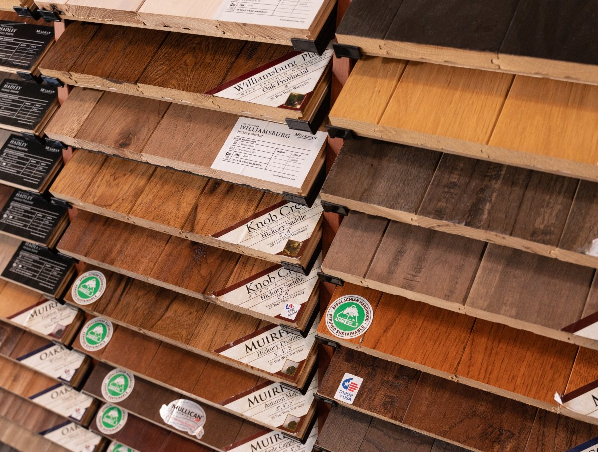 A display of different types of wooden flooring in a store.