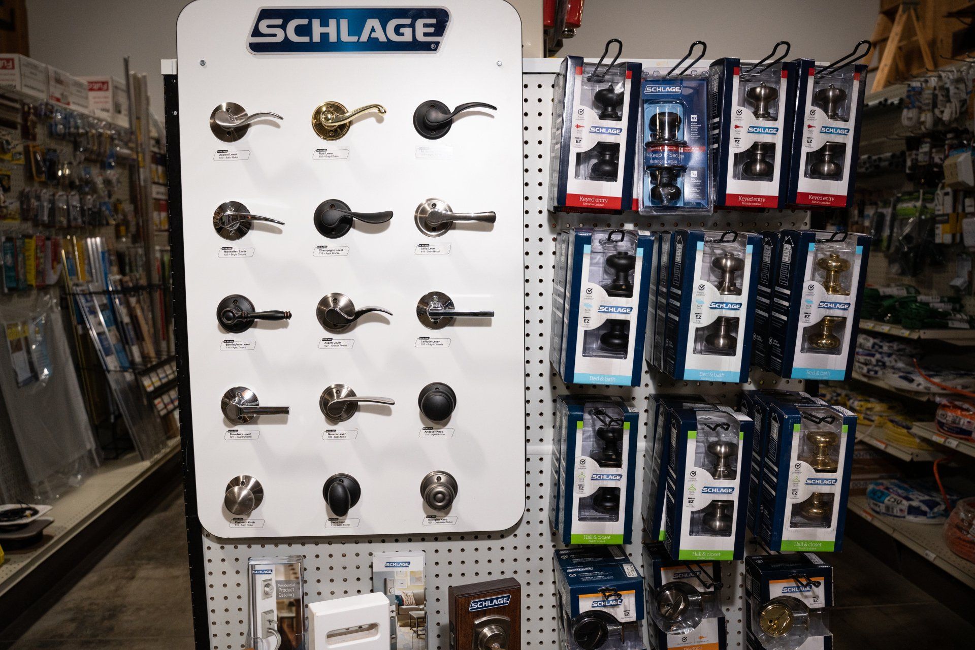 A display of door handles and locks in a hardware store.