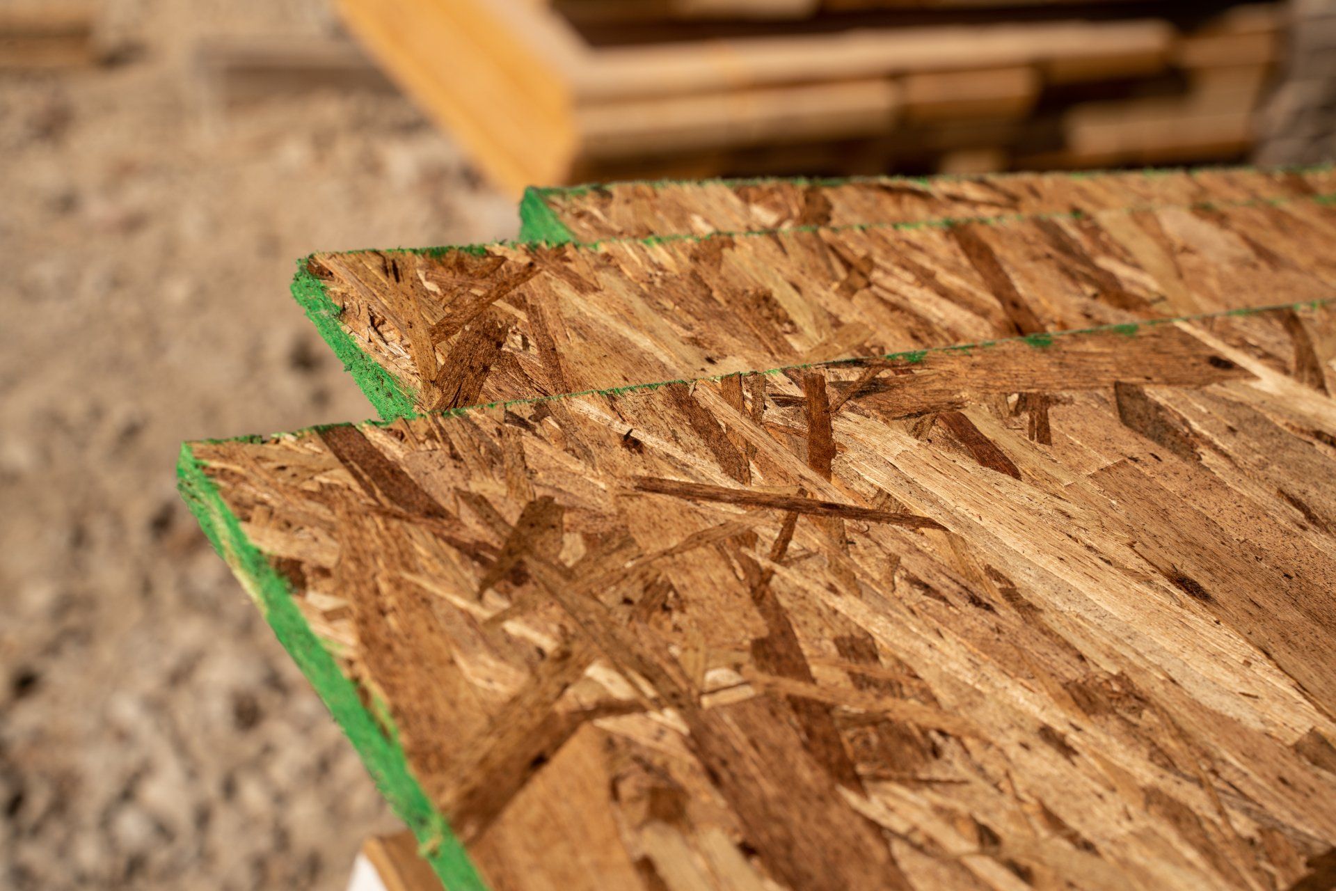A close up of three pieces of plywood stacked on top of each other.