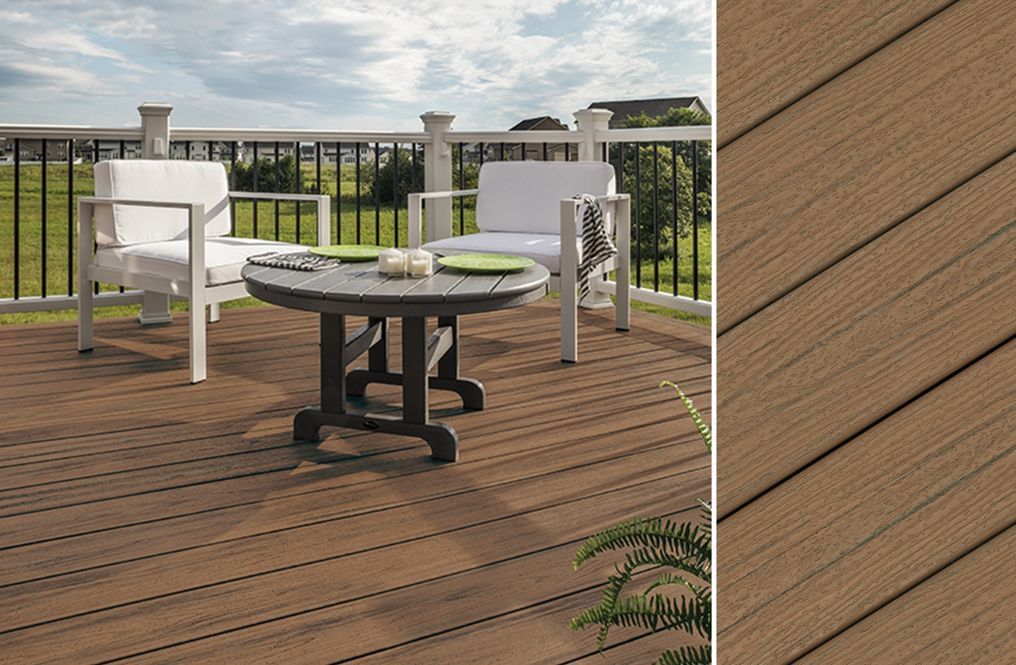 A wooden deck with a table and chairs on it.