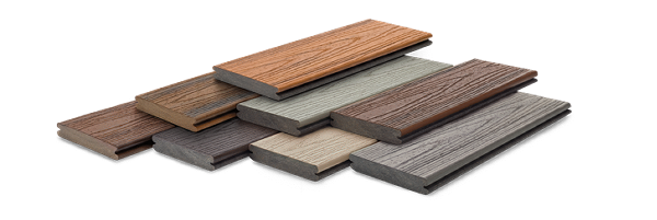 A pile of wooden boards of different colors are stacked on top of each other on a white background.