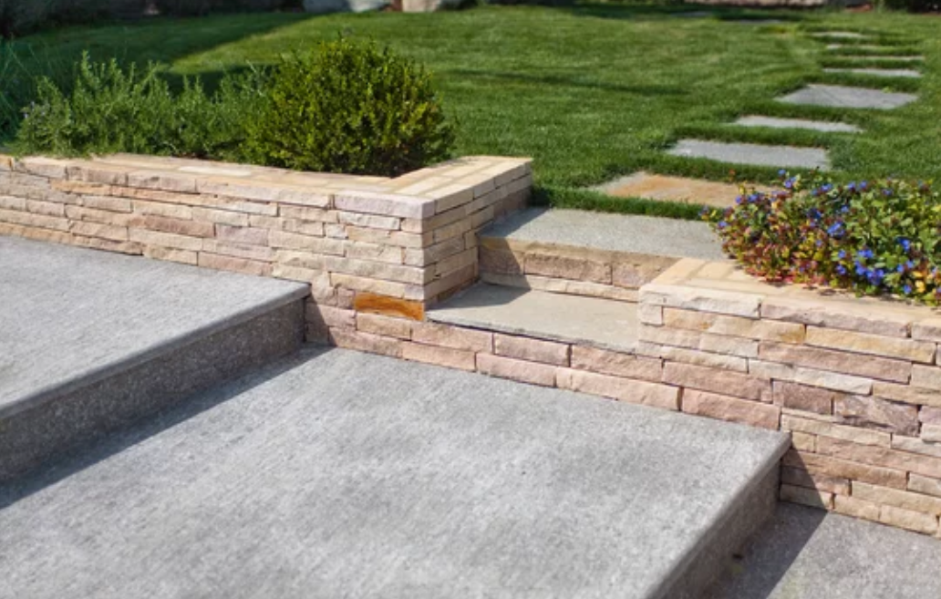 Scenic view of natural stone stairs leading through a lush and picturesque home garden.