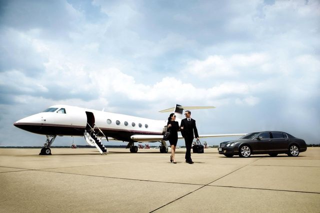 Business People At The Airport — Atlanta, GA — At Your Service Executive Limousine & Black Car Service