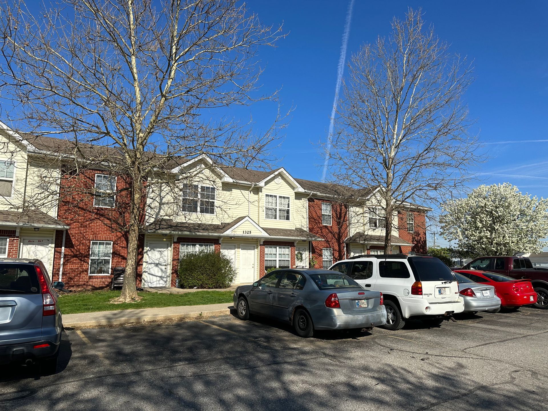 community parking lot area with trees