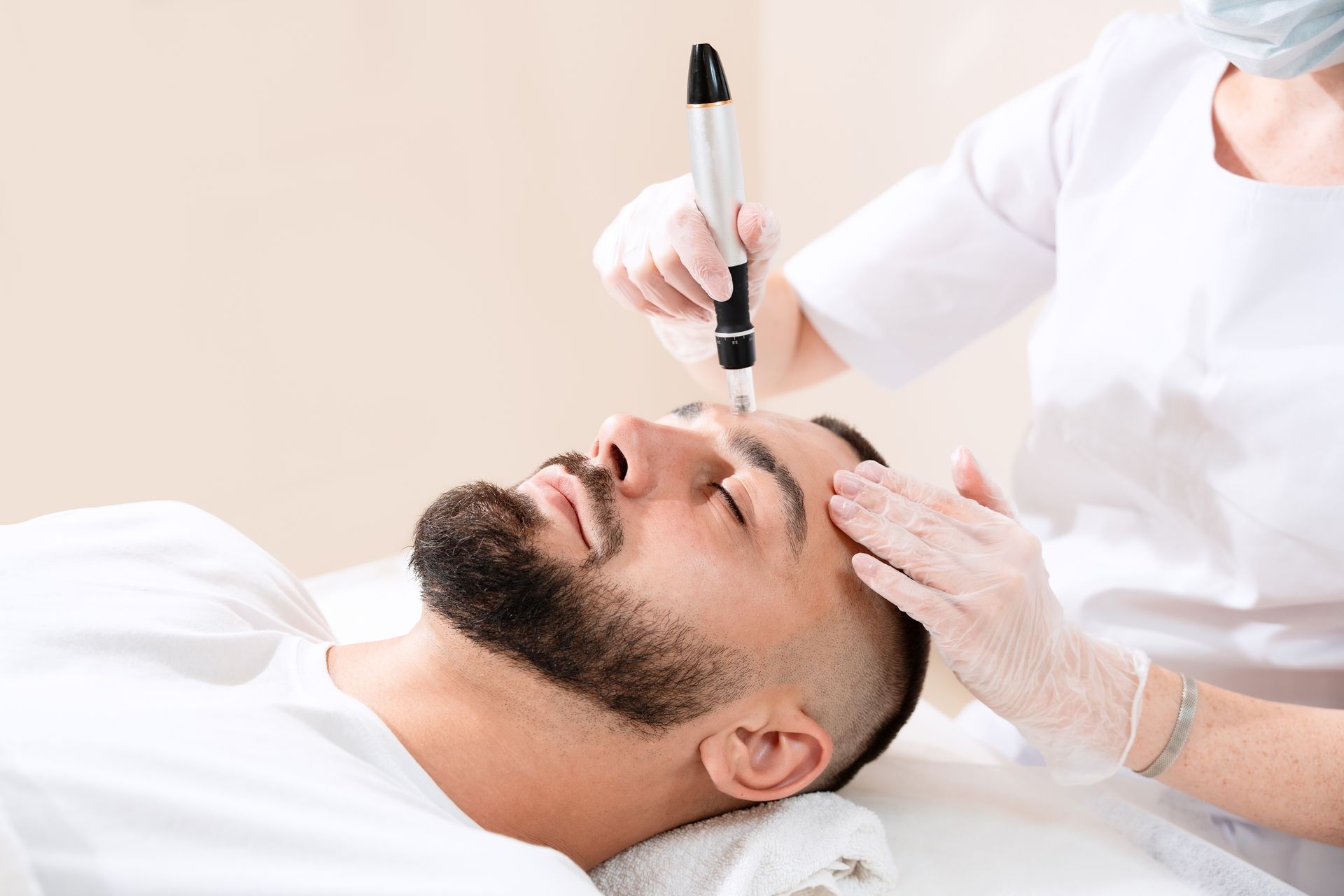 Woman on laser hair removal procedure at beauty salon