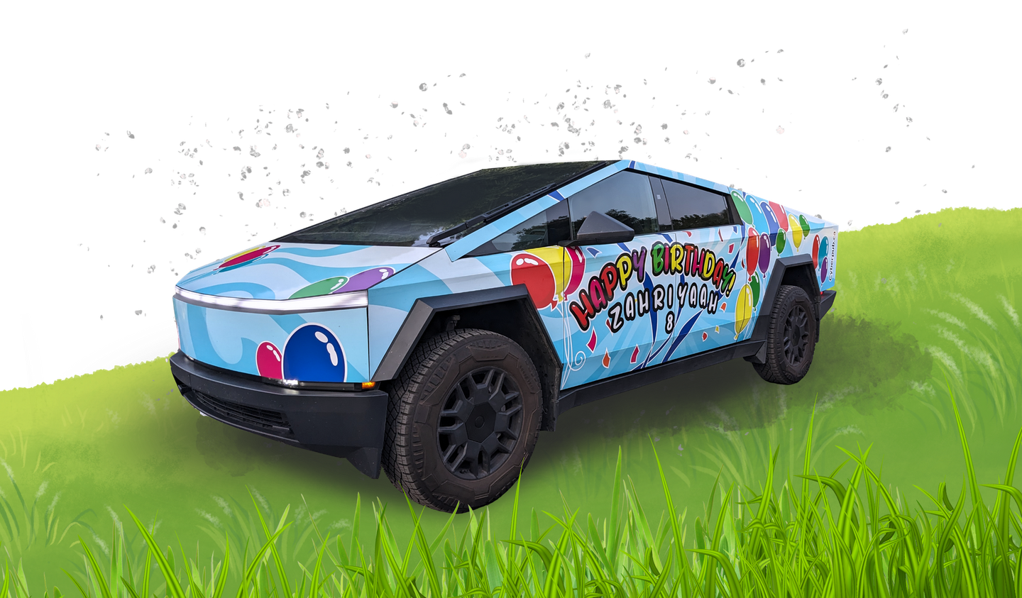Cybertruck with colorful birthday design on a grassy hill.