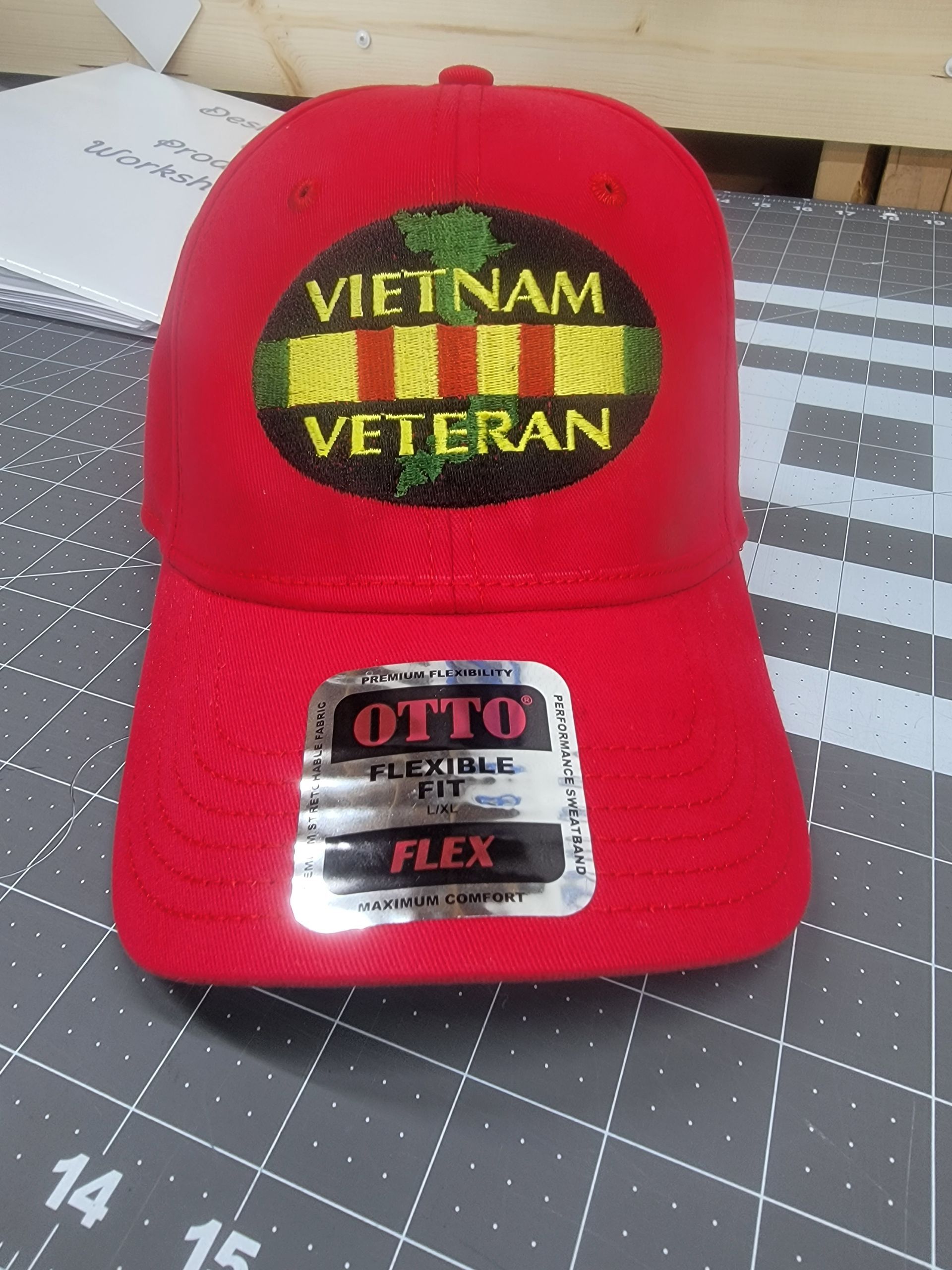 A red vietnam veteran hat is sitting on a cutting board