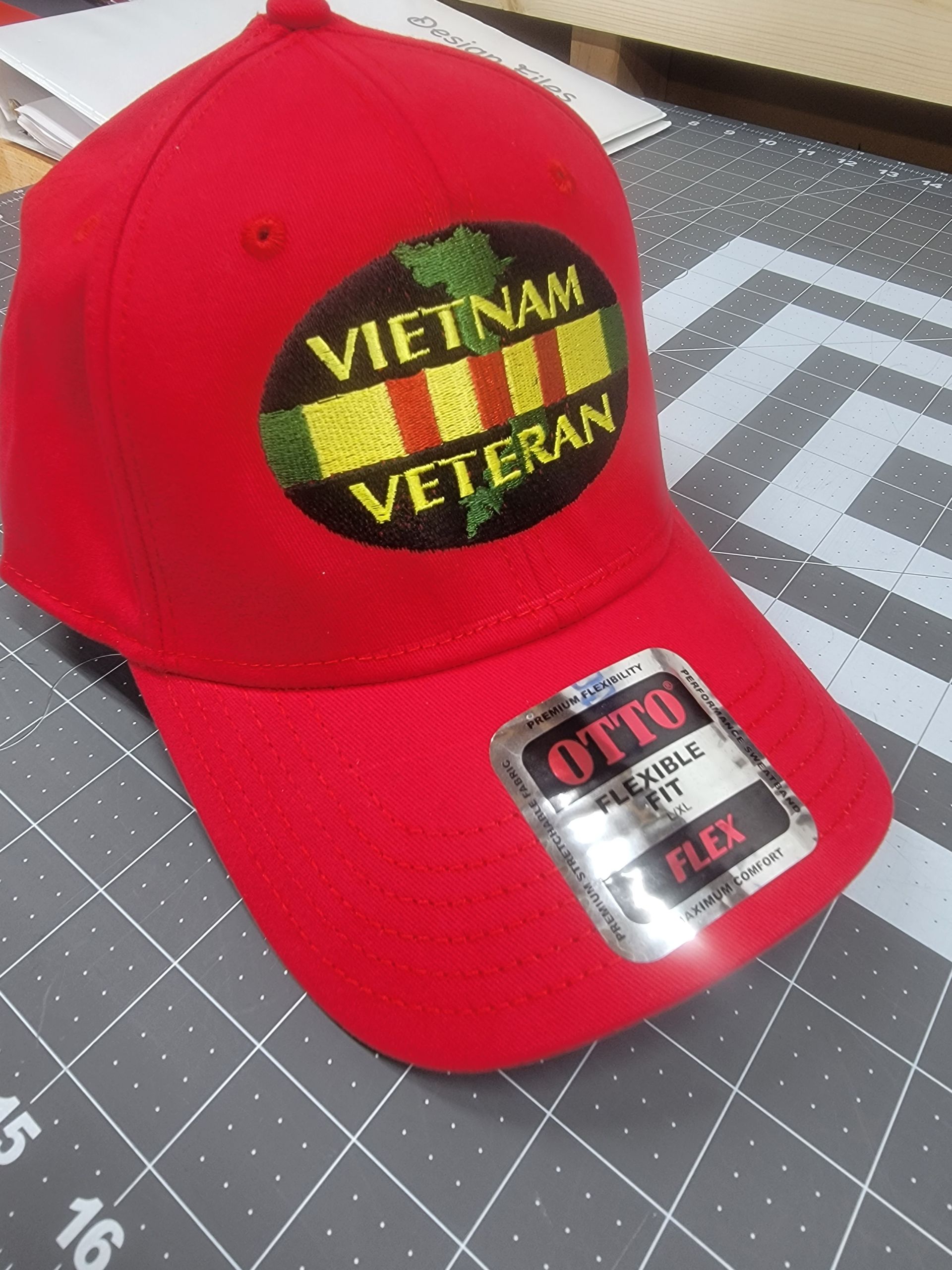 A red vietnam veteran hat is sitting on a cutting board