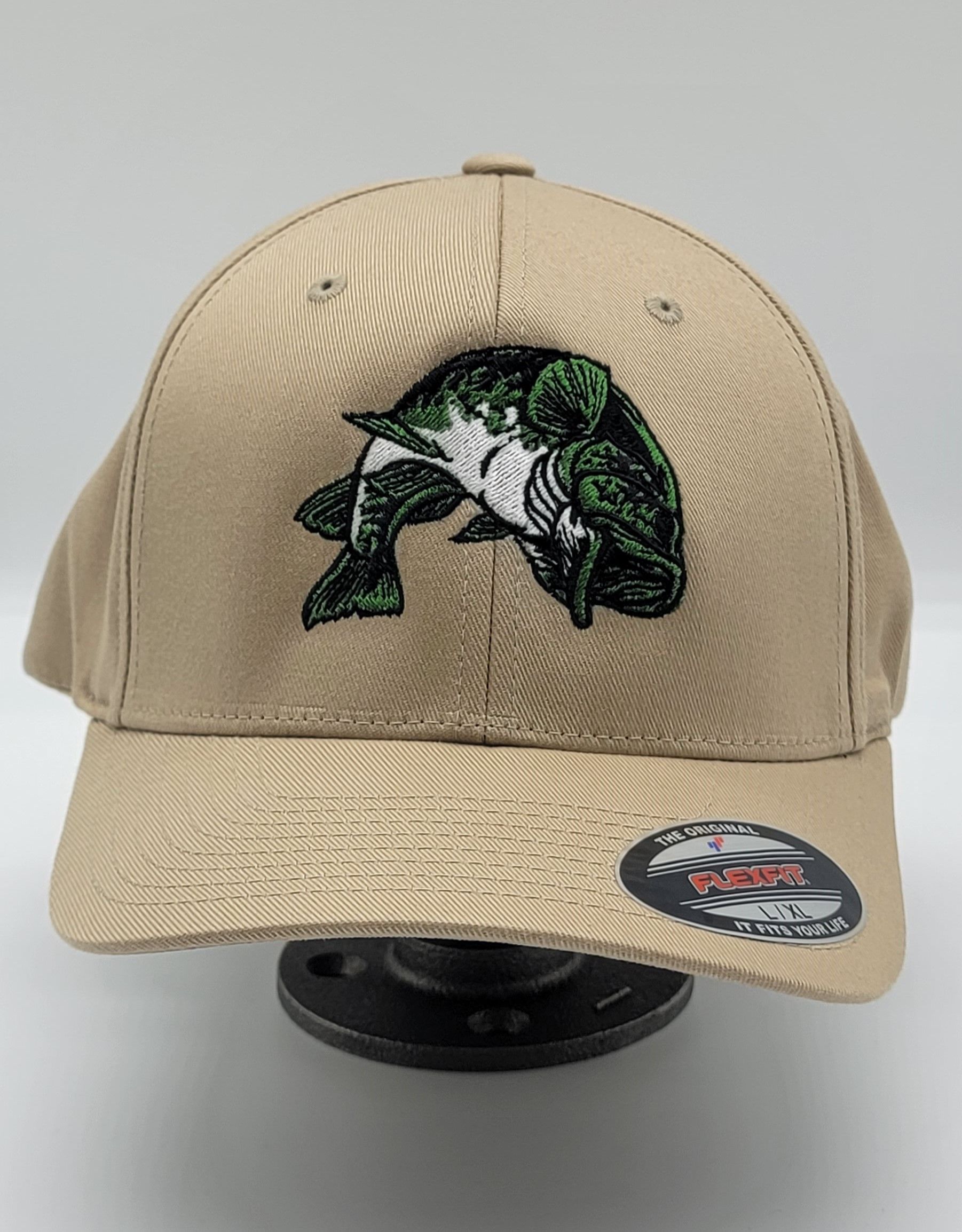 A baseball cap with a fish embroidered on it.