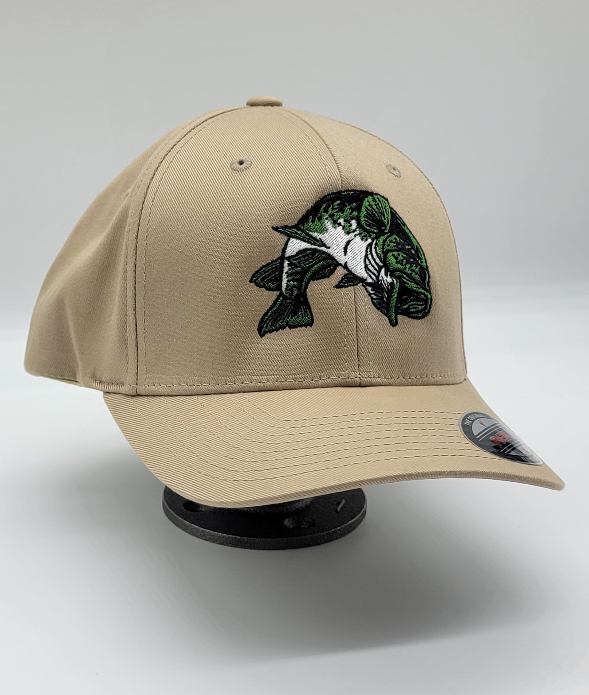 A baseball cap with a fish embroidered on it.
