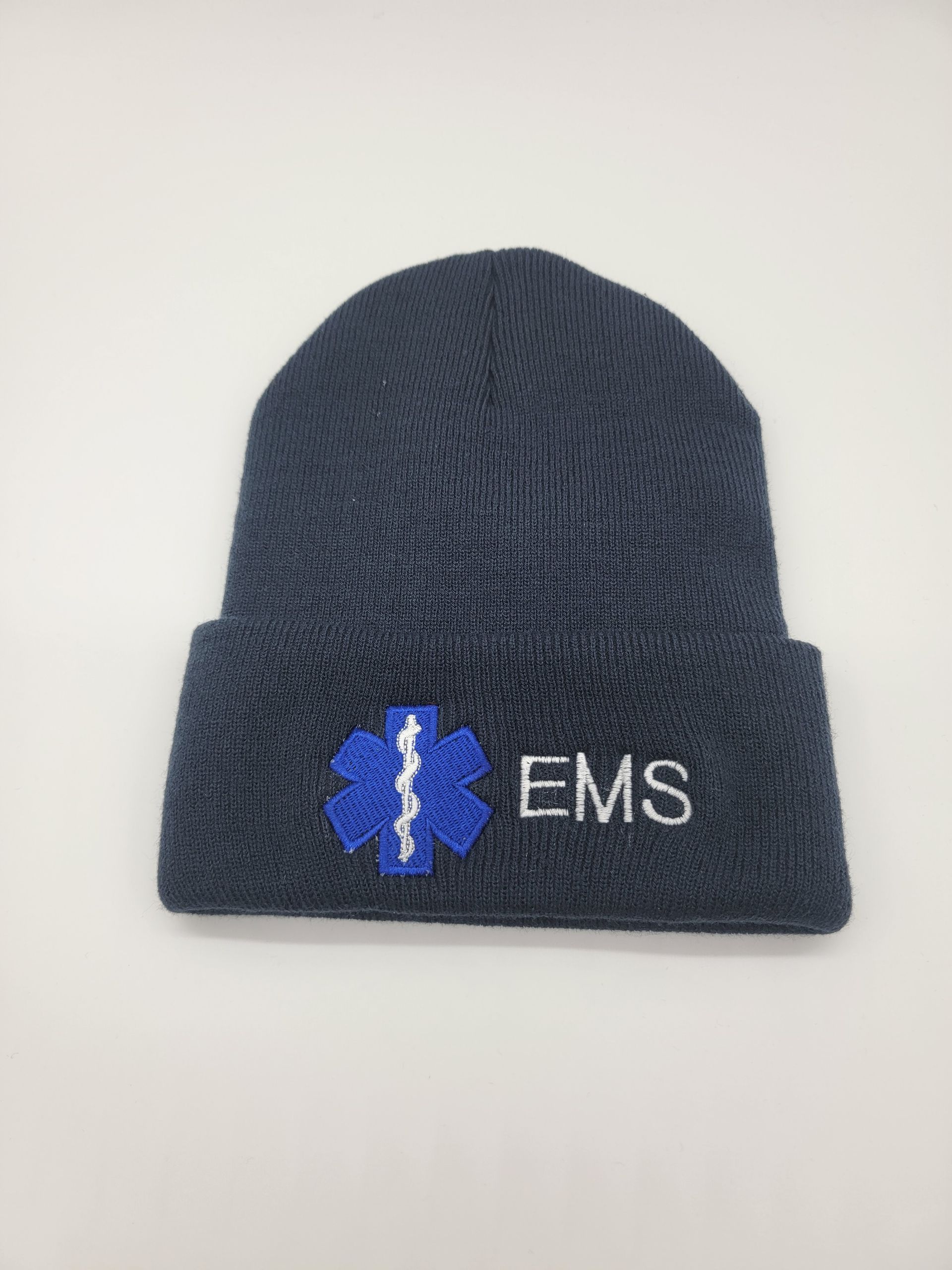 A black beanie with a blue star of life embroidered on it.