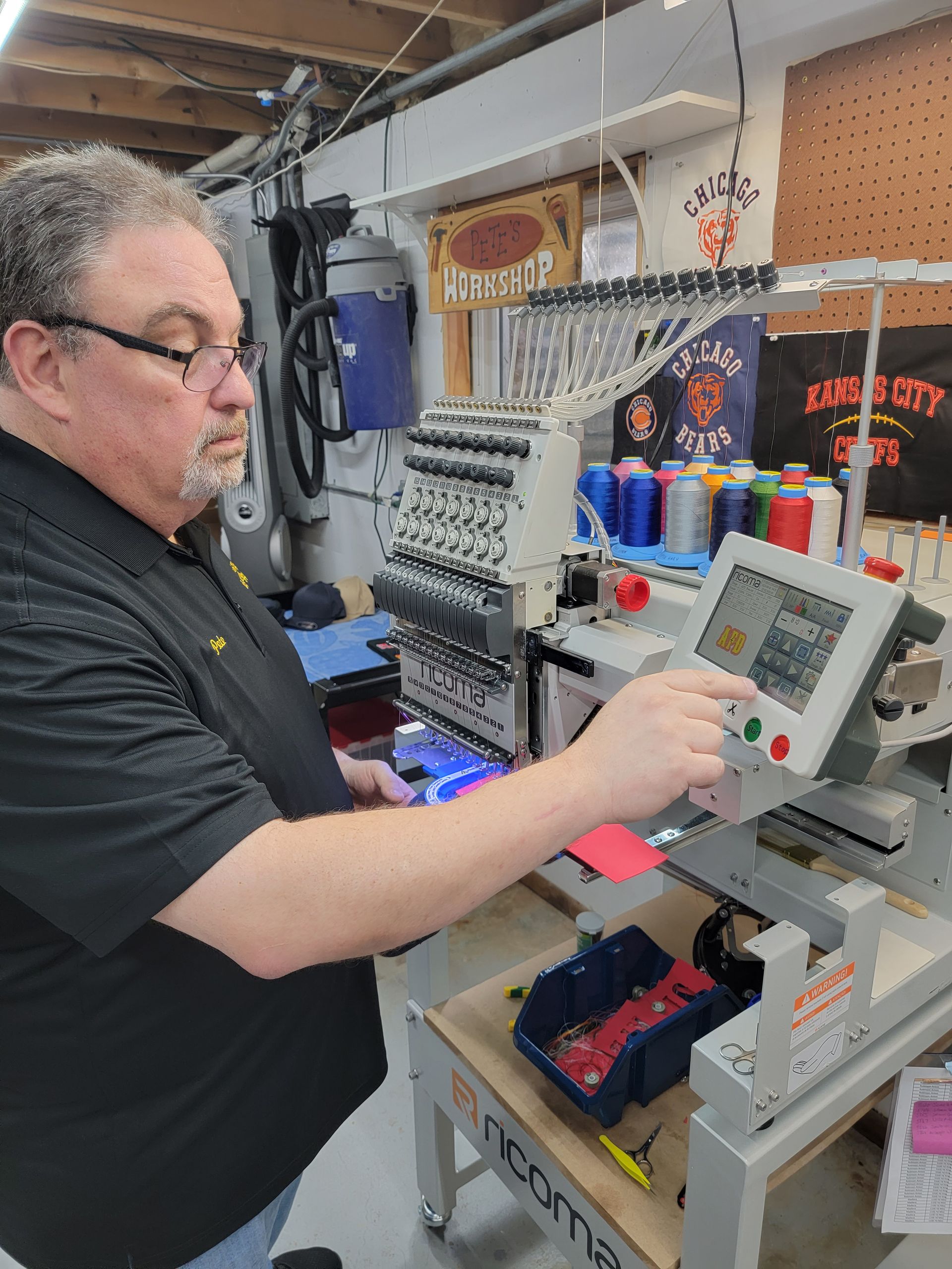 A man is working on a machine in a factory.