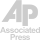 Associated Press logo: stylized "AP" letters in gray above "Associated Press" in gray text.