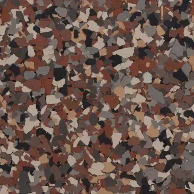Close-up of a speckled epoxy floor coating in shades of brown, gray, and black.