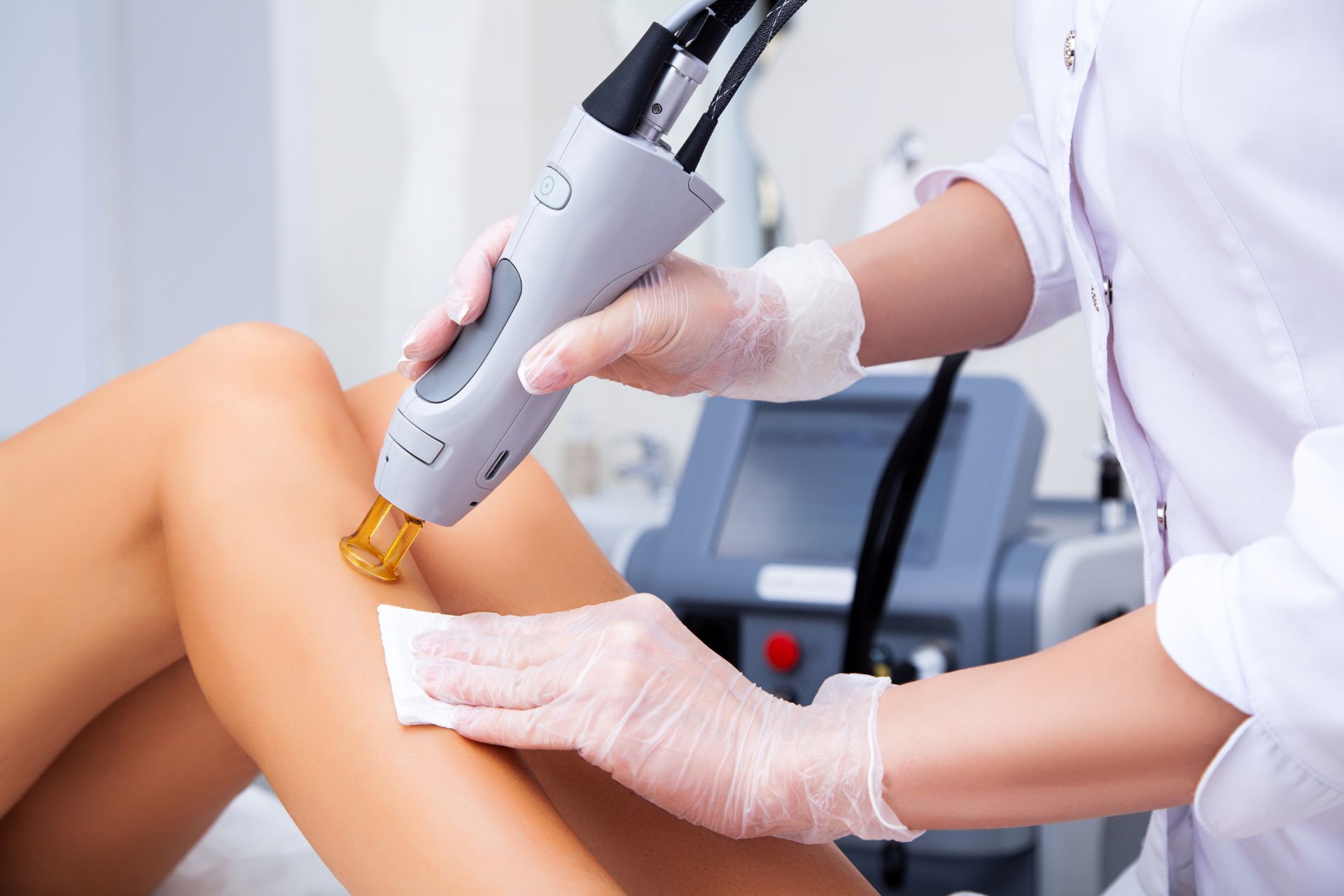 technician uses laser to remove leg hair