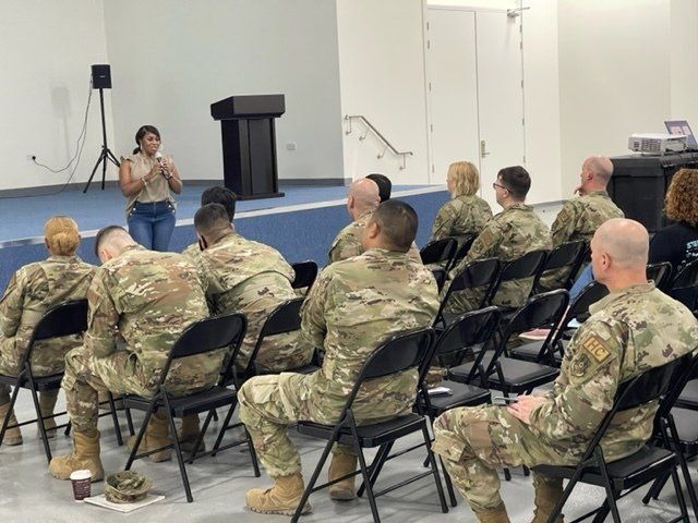 Stephanie LaPierre (CEO) giving a presentation to a group of soldiers on a military base