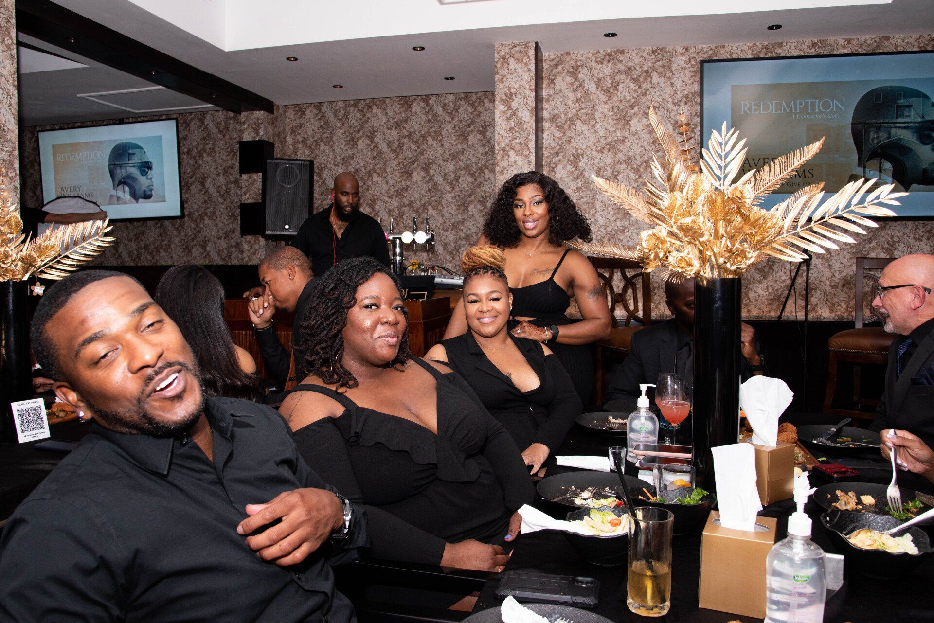 Stephanie LaPierre (CEO) hosting a party with several others dressed in all black