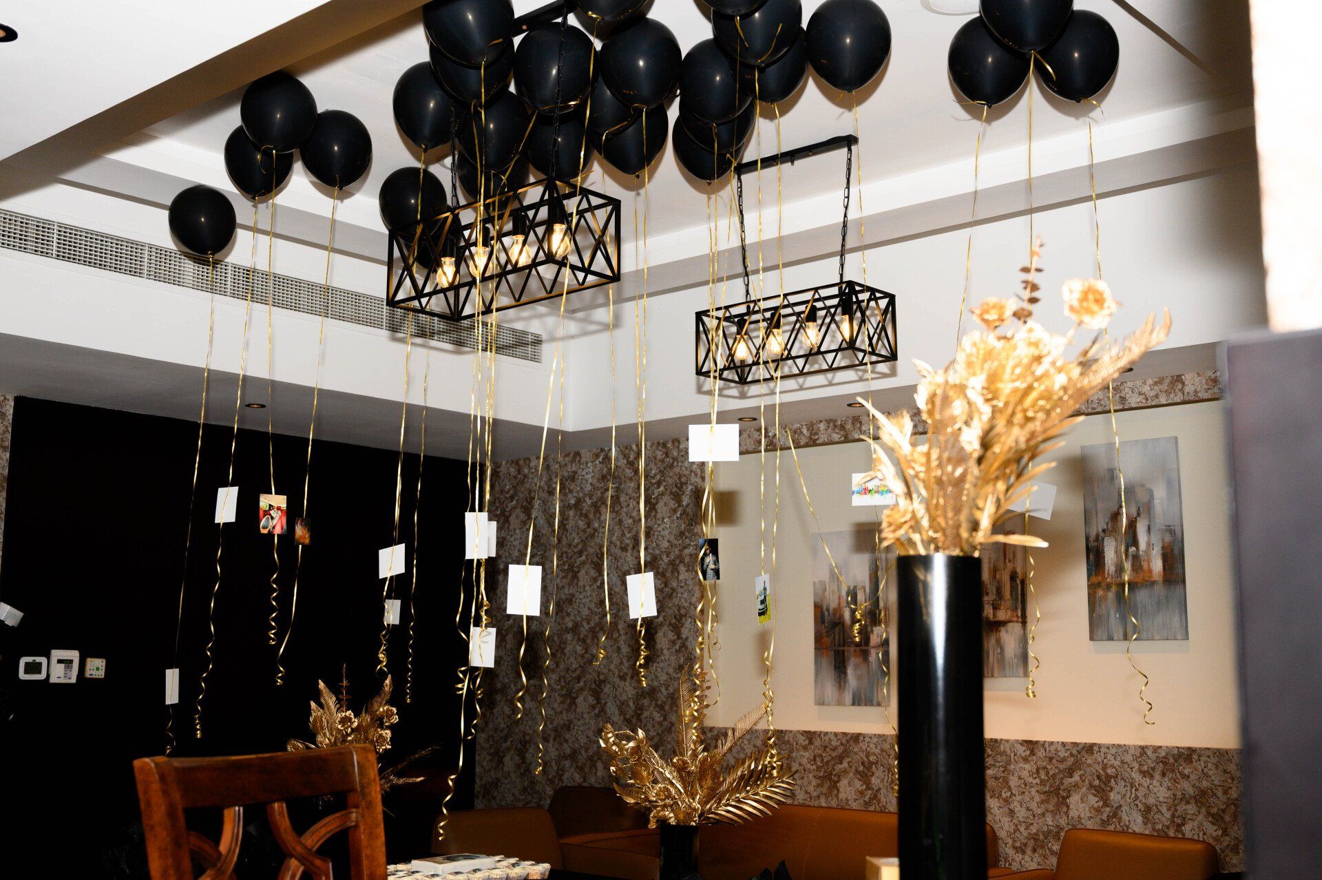 Upscale black and gold themed party space set-up