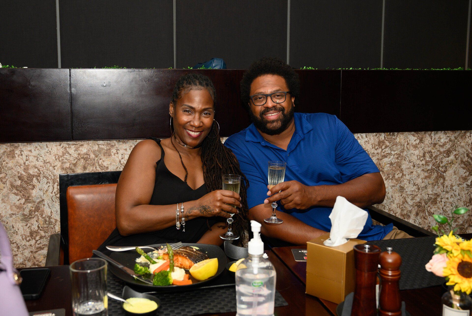 A man and woman having dinner