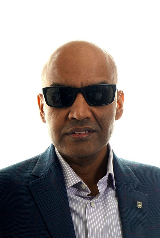 A man dressed in a smart outfit.