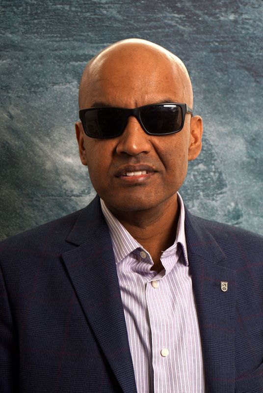 A man dressed in a smart outfit.