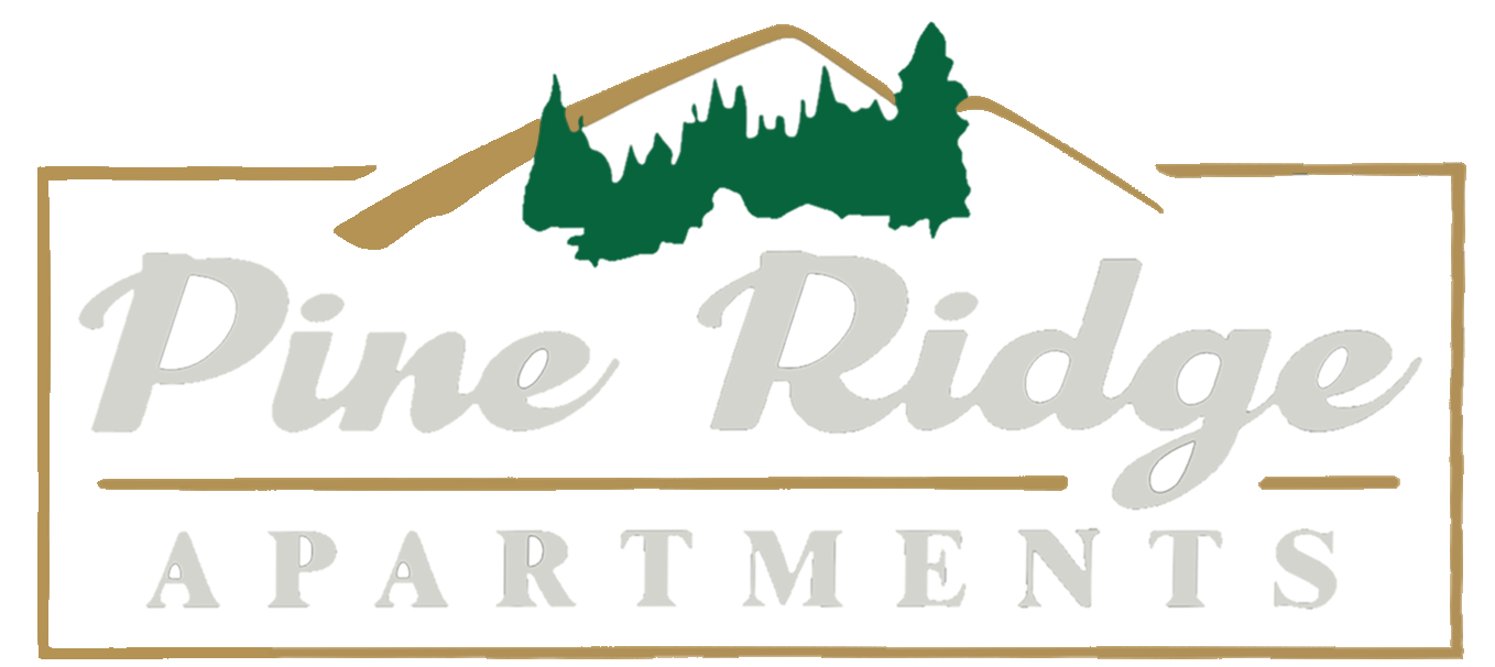 The pine ridge apartments logo has a mountain and trees on it.