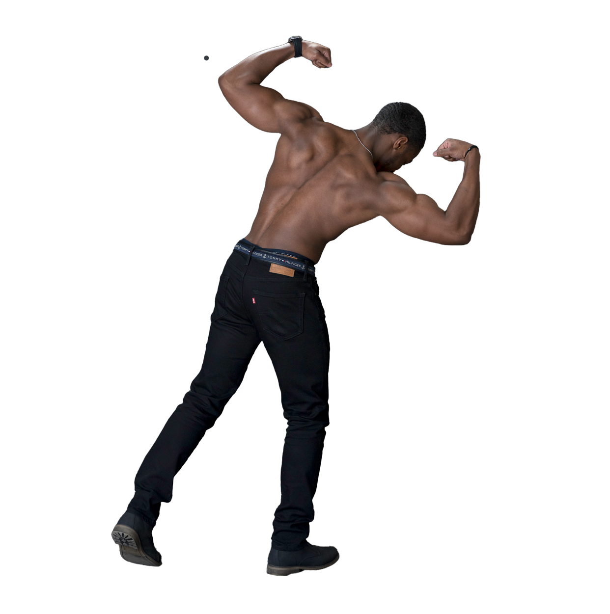 a shirtless man is flexing his muscles in front of a black background