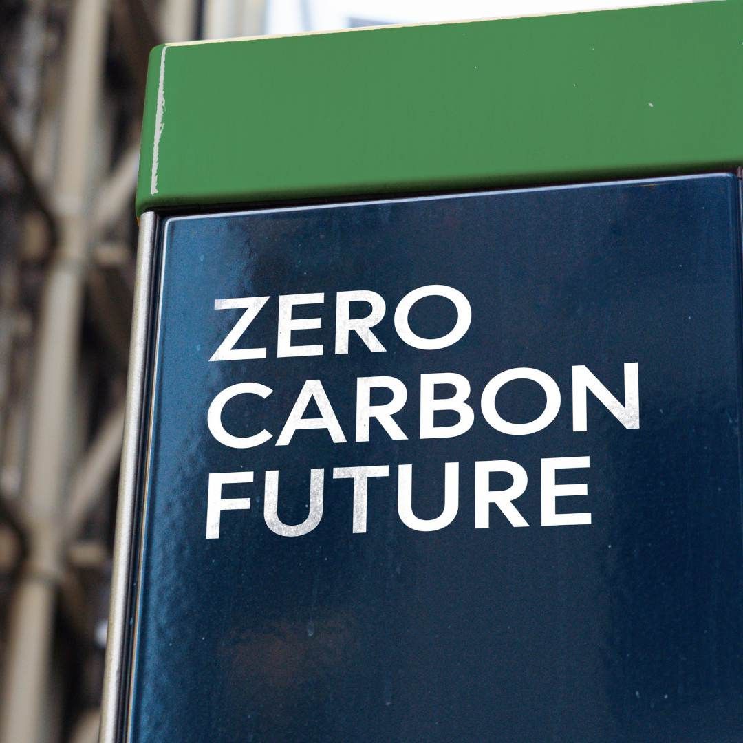 A sign that says zero carbon future on it