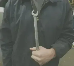 Our Mechanic Holds Wrench - Auto Evaluator