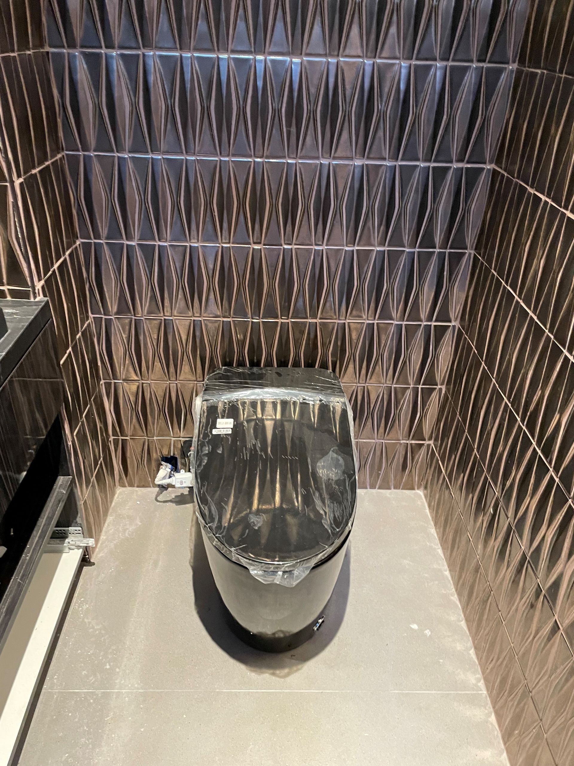 A bathroom with a toilet and a sink in it.