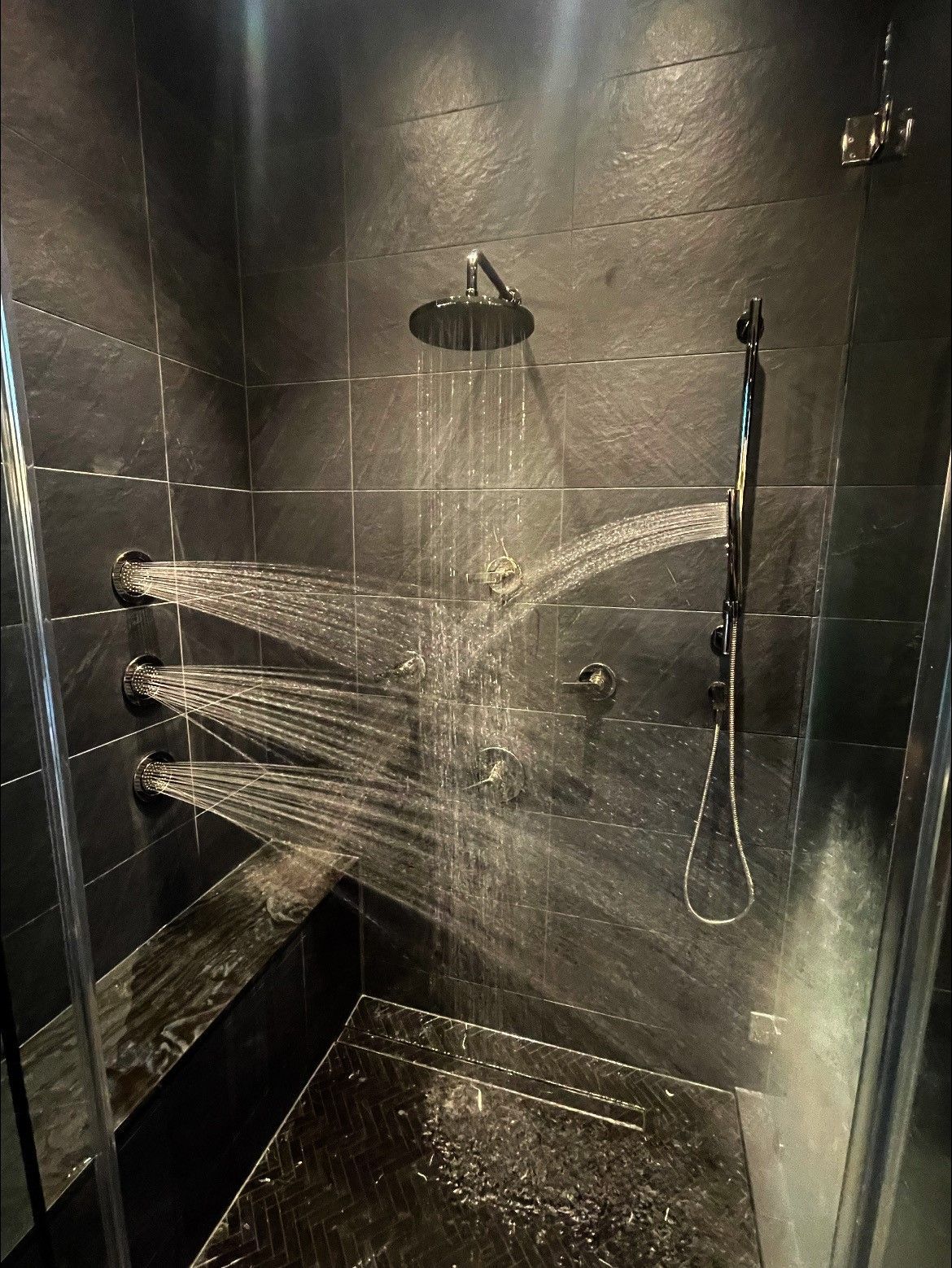 A shower with a lot of water coming out of it.
