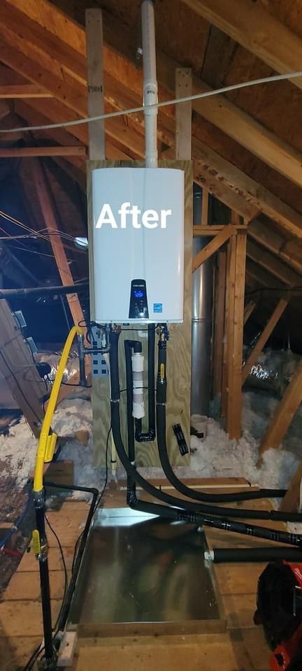 A picture of a water heater in an attic.