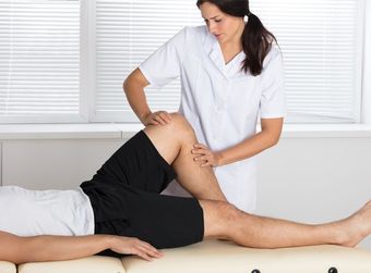 Physical Therapy — Physiotherapist Giving Leg Exercise in Mill Valley, CA
