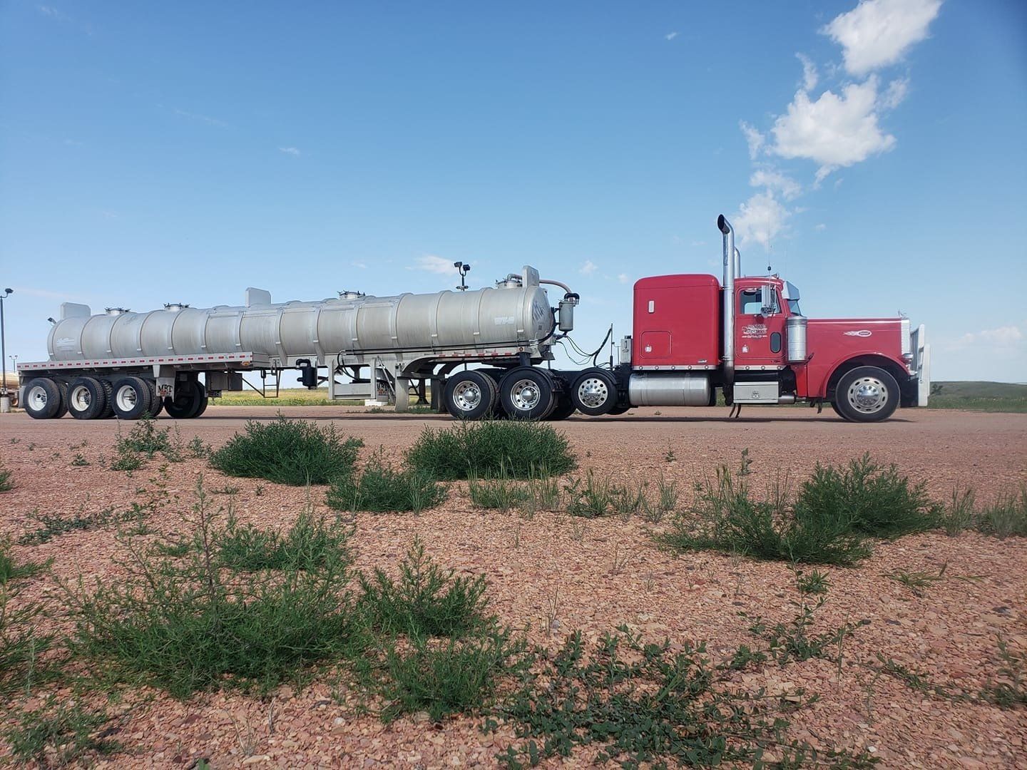 Side view of a long red truck