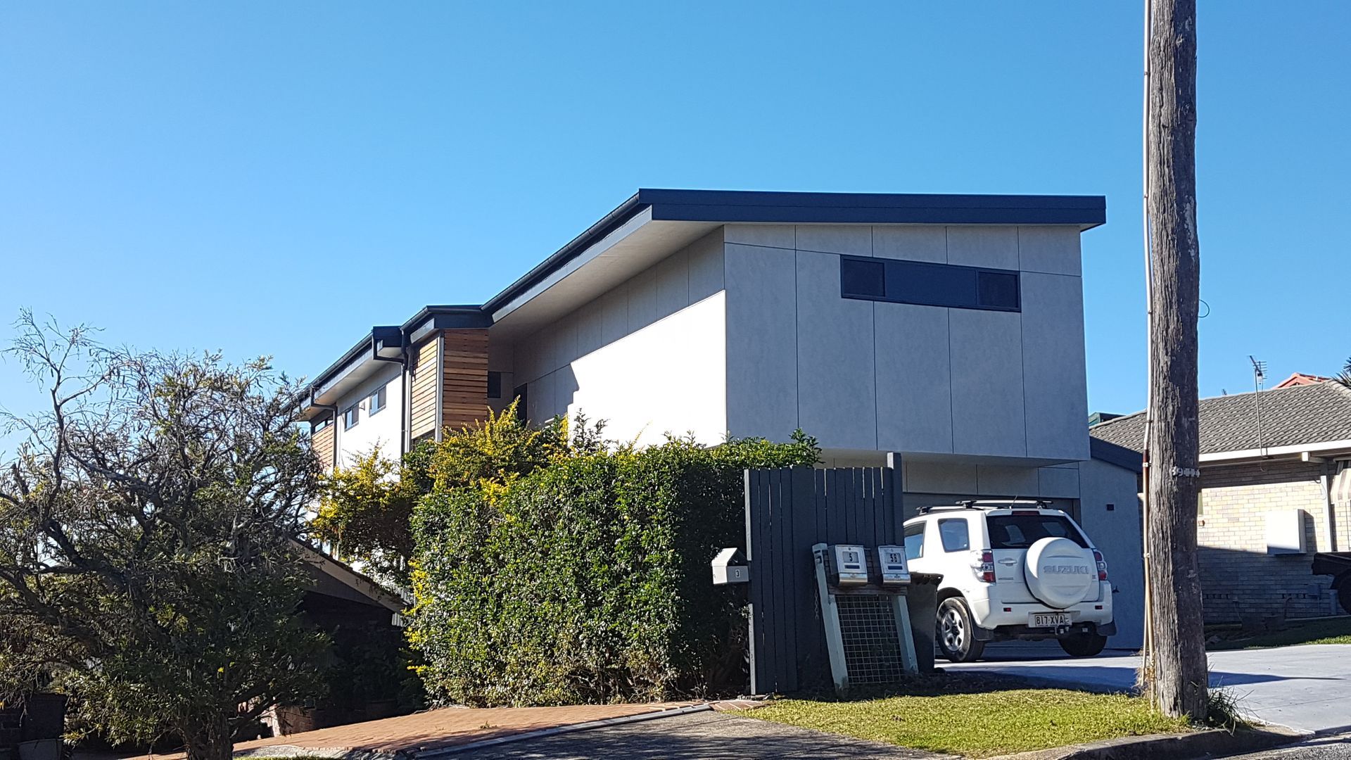 Two-story Modern Building With Gray Exterior and Blue Trim — Acheson Building Certification in Nambucca Heads, NSW
