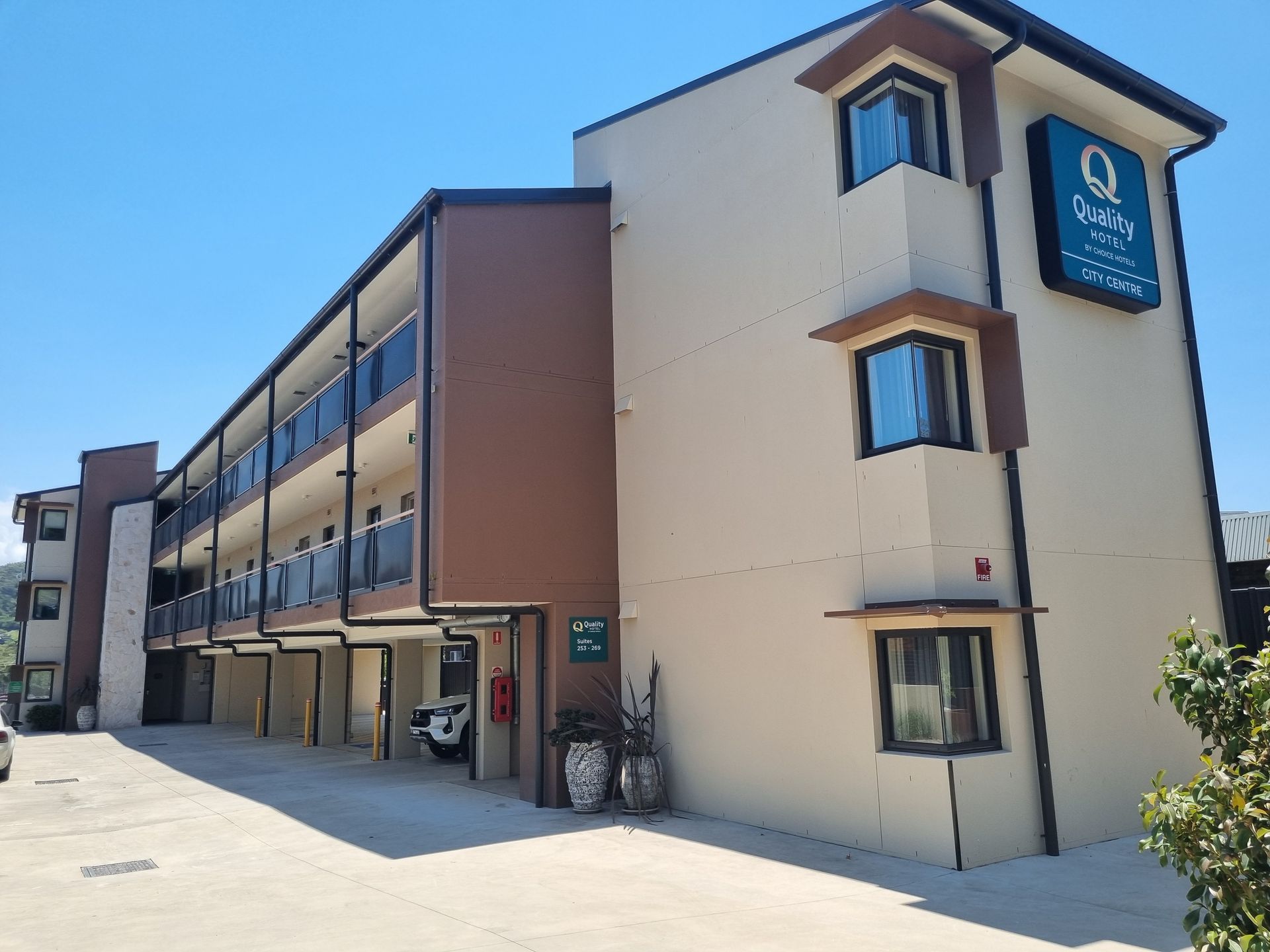 Exterior of the Quality Inn Hotel With a Beige Facade — Acheson Building Certification in Nambucca Heads, NSW