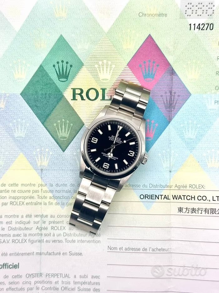Orologio Rolex Explorer su un foglio di carta con il logo Rolex, il numero di serie e il testo in giapponese.