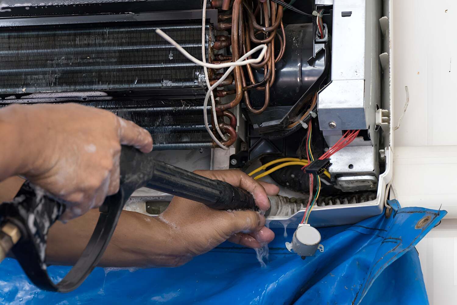 A Man Clean The Aircon — Electrical Worx Warwick P/L In Warwick, QLD