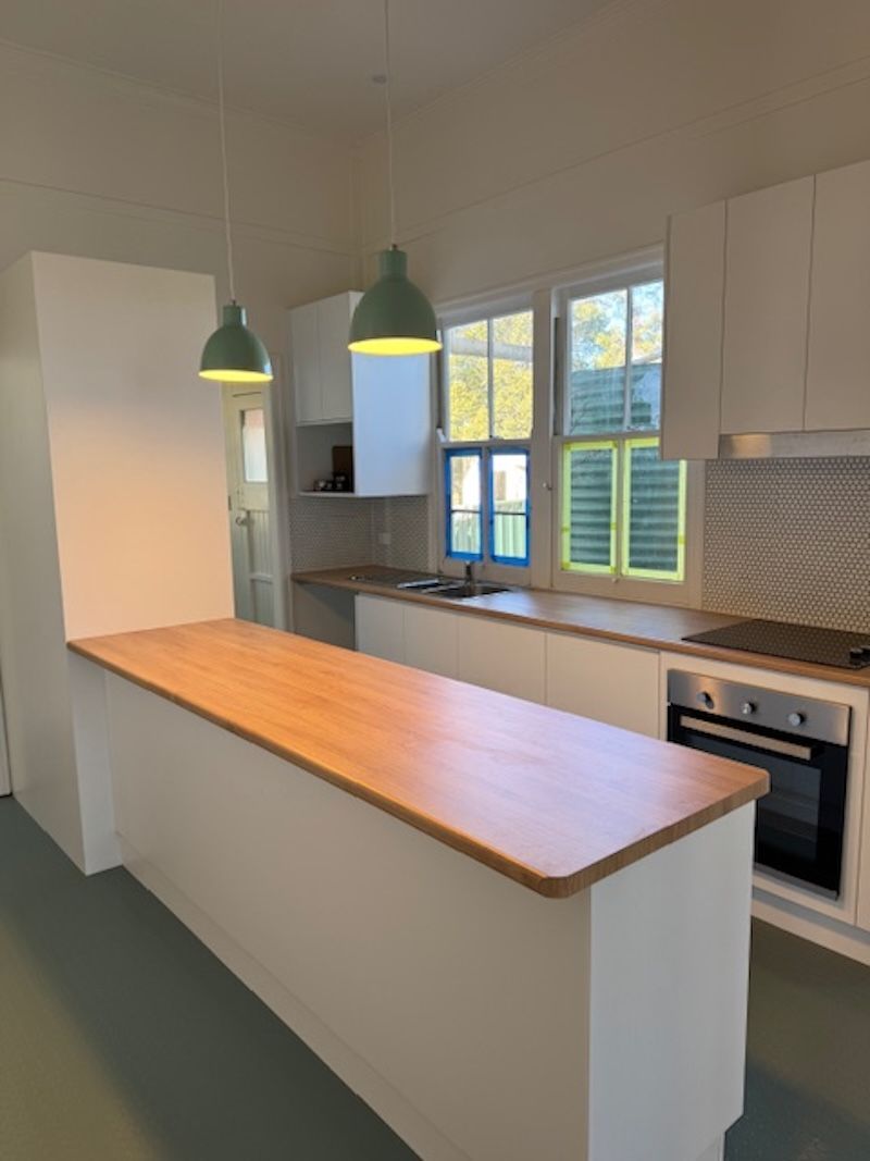 A Close Up of a Person Working on a Wire on a Table — Electrical Worx Warwick P/L In Warwick, QLD
